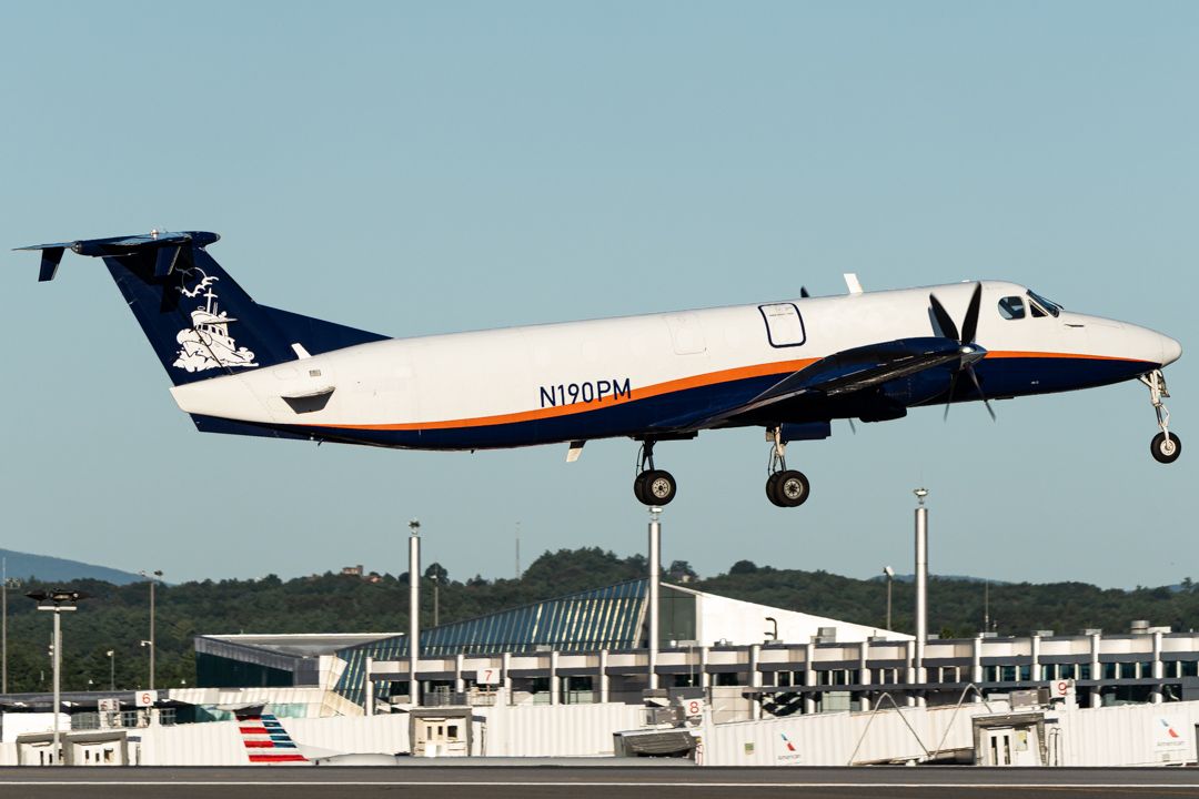 Photo of N190PM - Planemaster Services Beechcraft 1900C at MHT on AeroXplorer Aviation Database