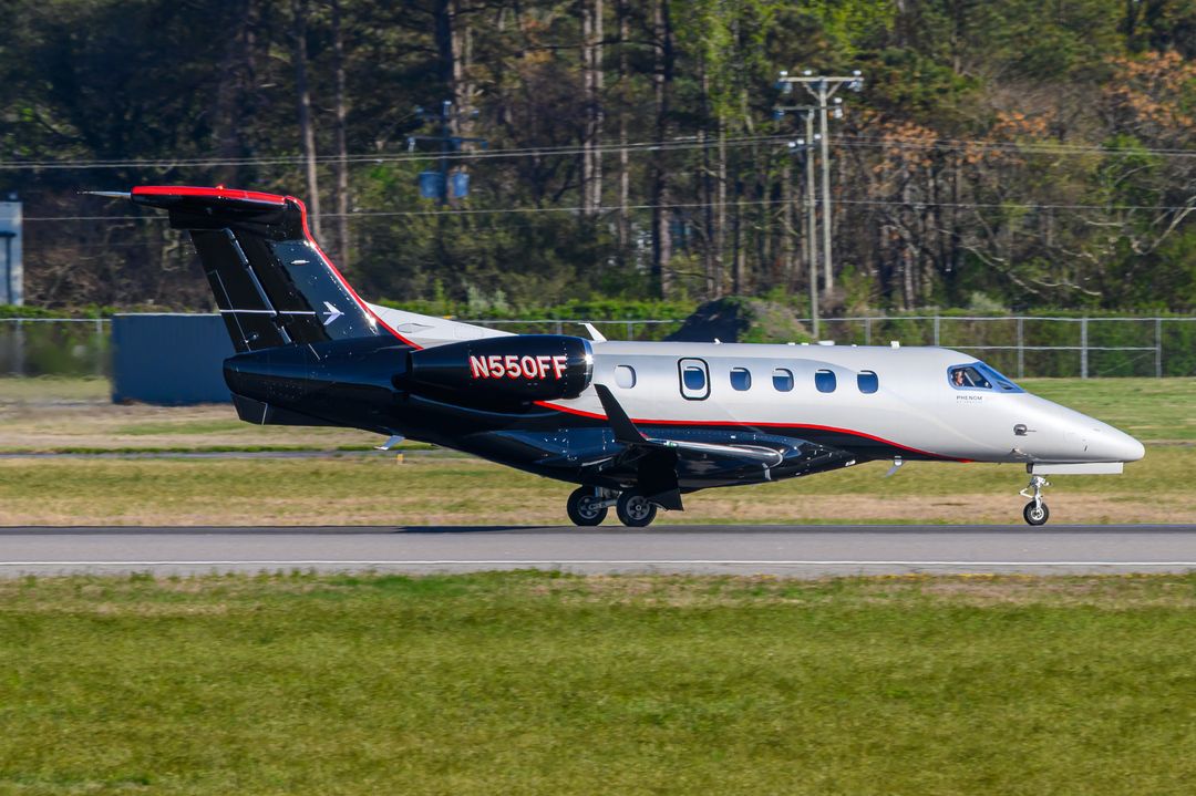 PRIVATE Embraer Phenom 300 registration  on final approach at Norfolk International Airport (ORF/KORF) photographed by  on 03/29/2026