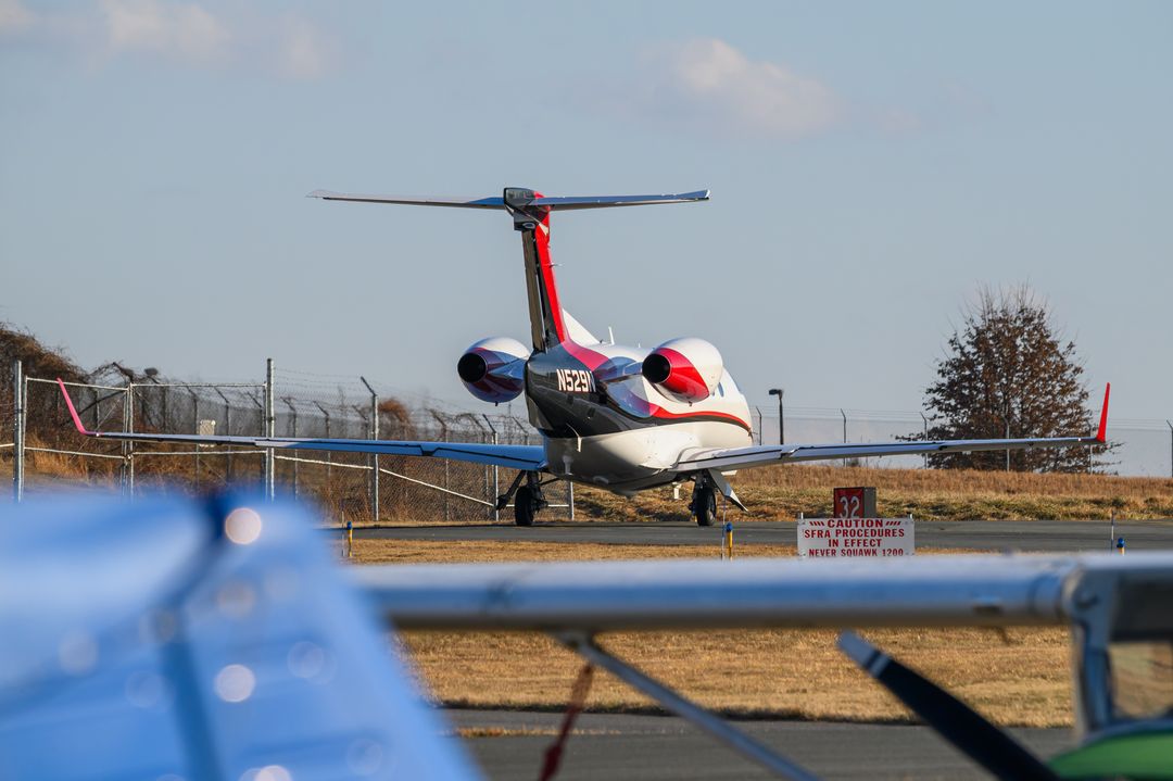 PRIVATE Embraer Phenom 300 registration  on final approach at Montgomery County Airpark (GAI/KGAI) photographed by  on 01/19/2026