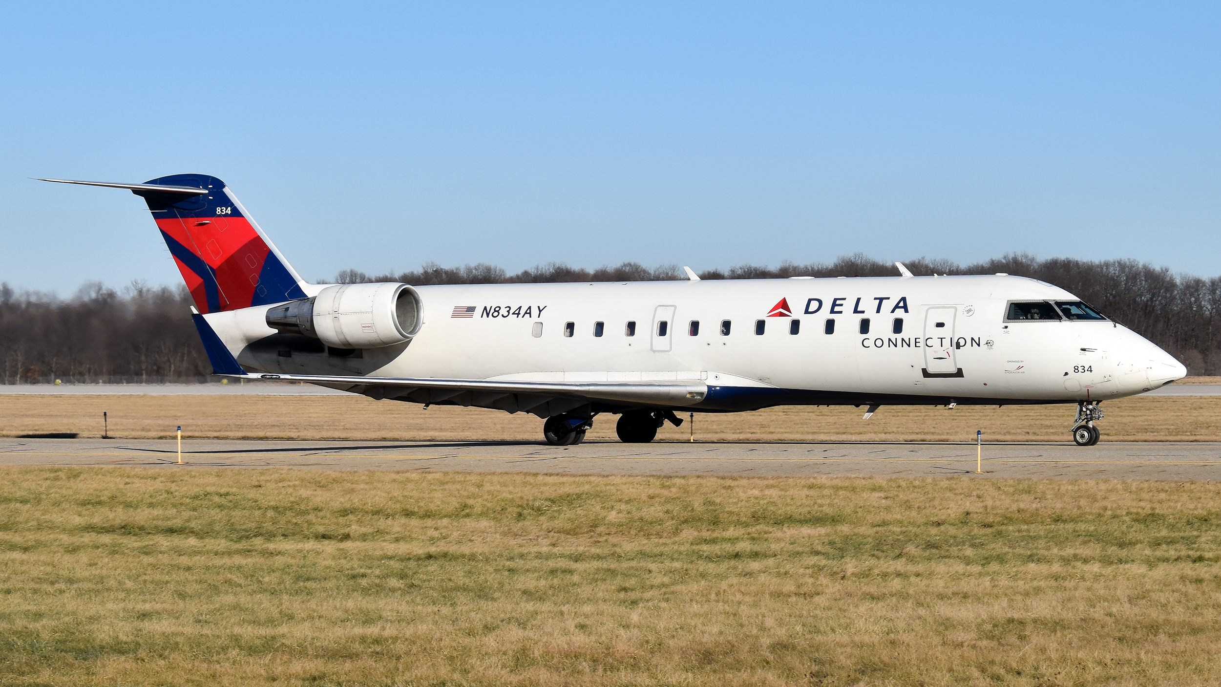 Full size: Delta Connection Mitsubishi CRJ-200 N834AY at Kalamazoo Battle Creek International Airport
