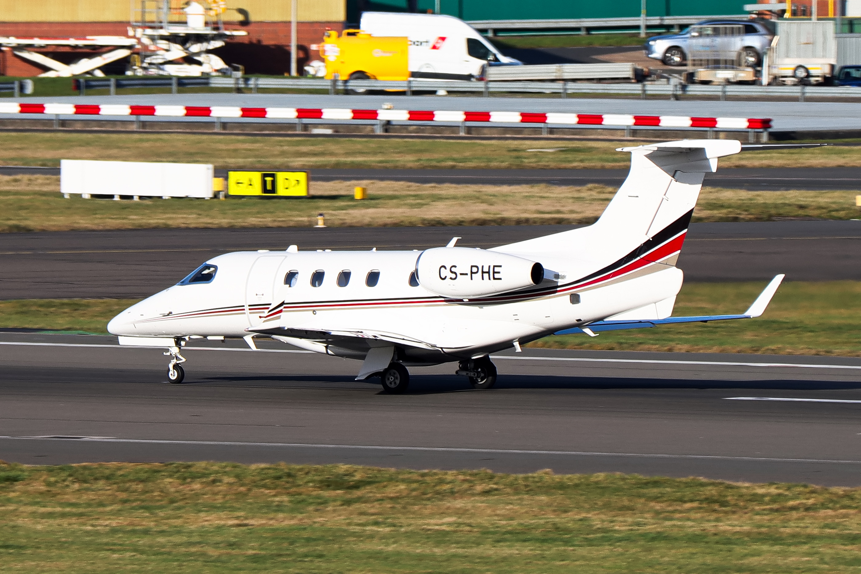 Full size: NetJets Embraer 505 phenom 300 CS-PHE at Birmingham Airport