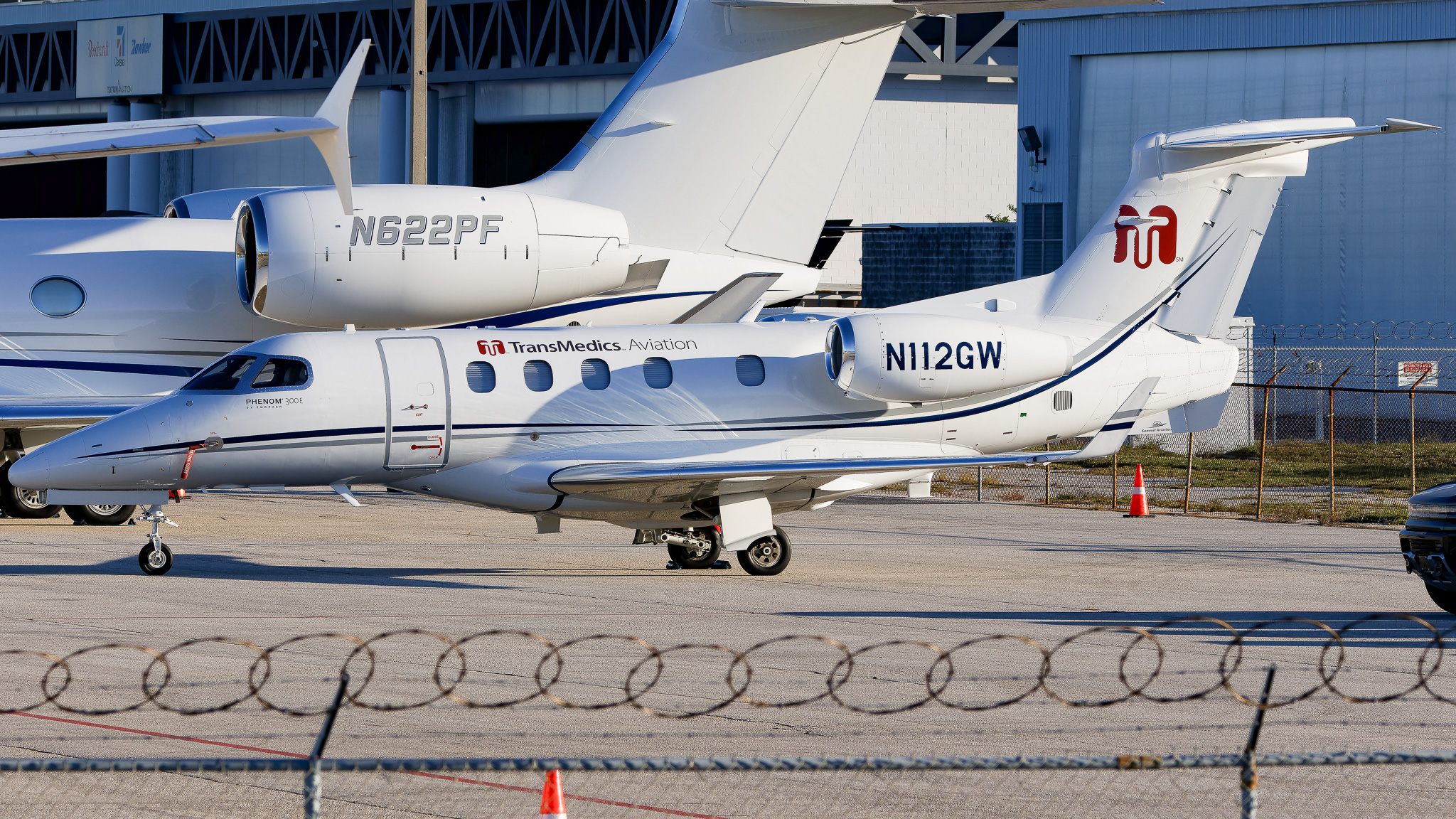 Full size: PRIVATE  Embraer 505 Phenom 300E N112GW at Tampa International Airport