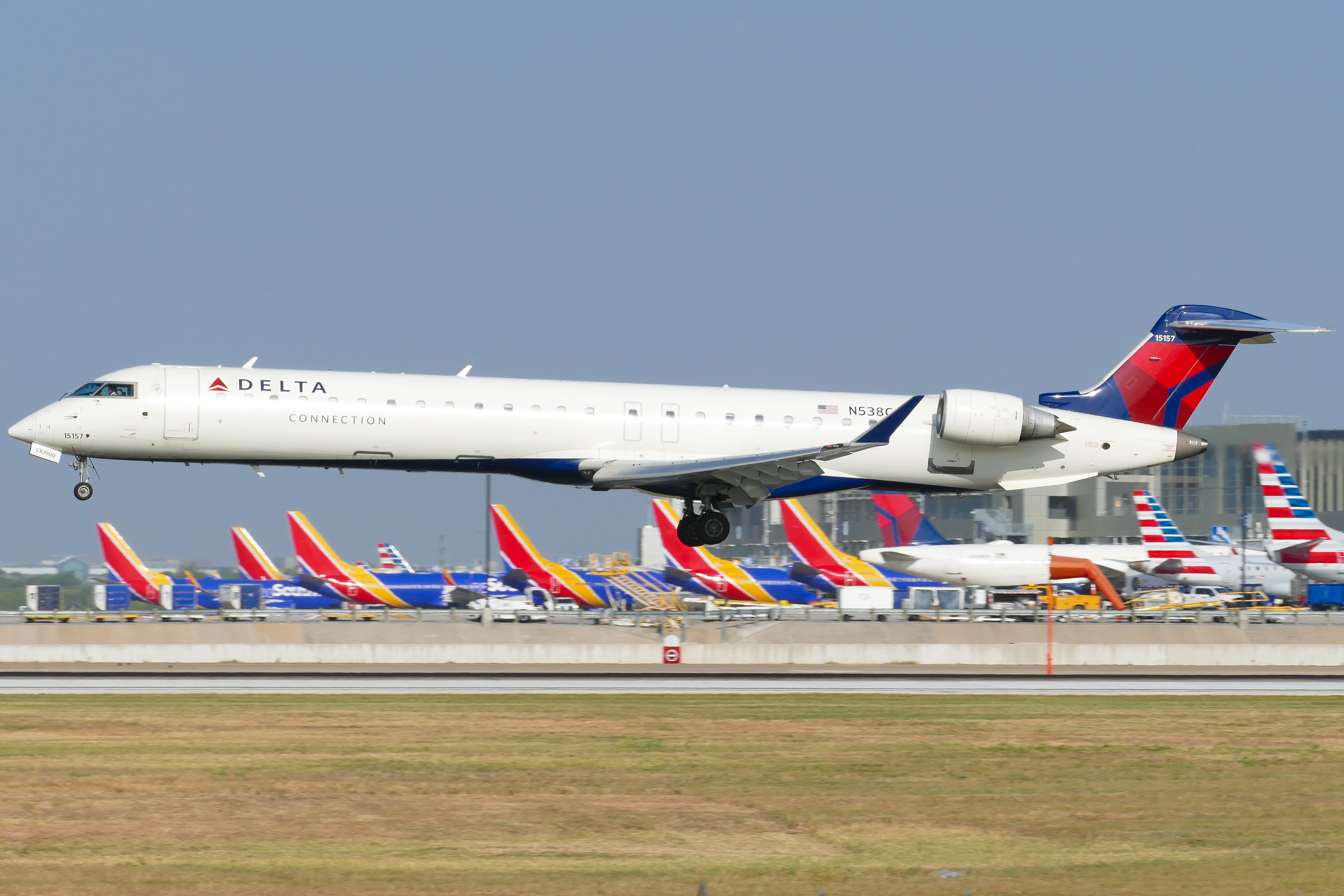 Full size: Delta Connection Mitsubishi CRJ-900 N538CA at Austin-Bergstrom International Airport