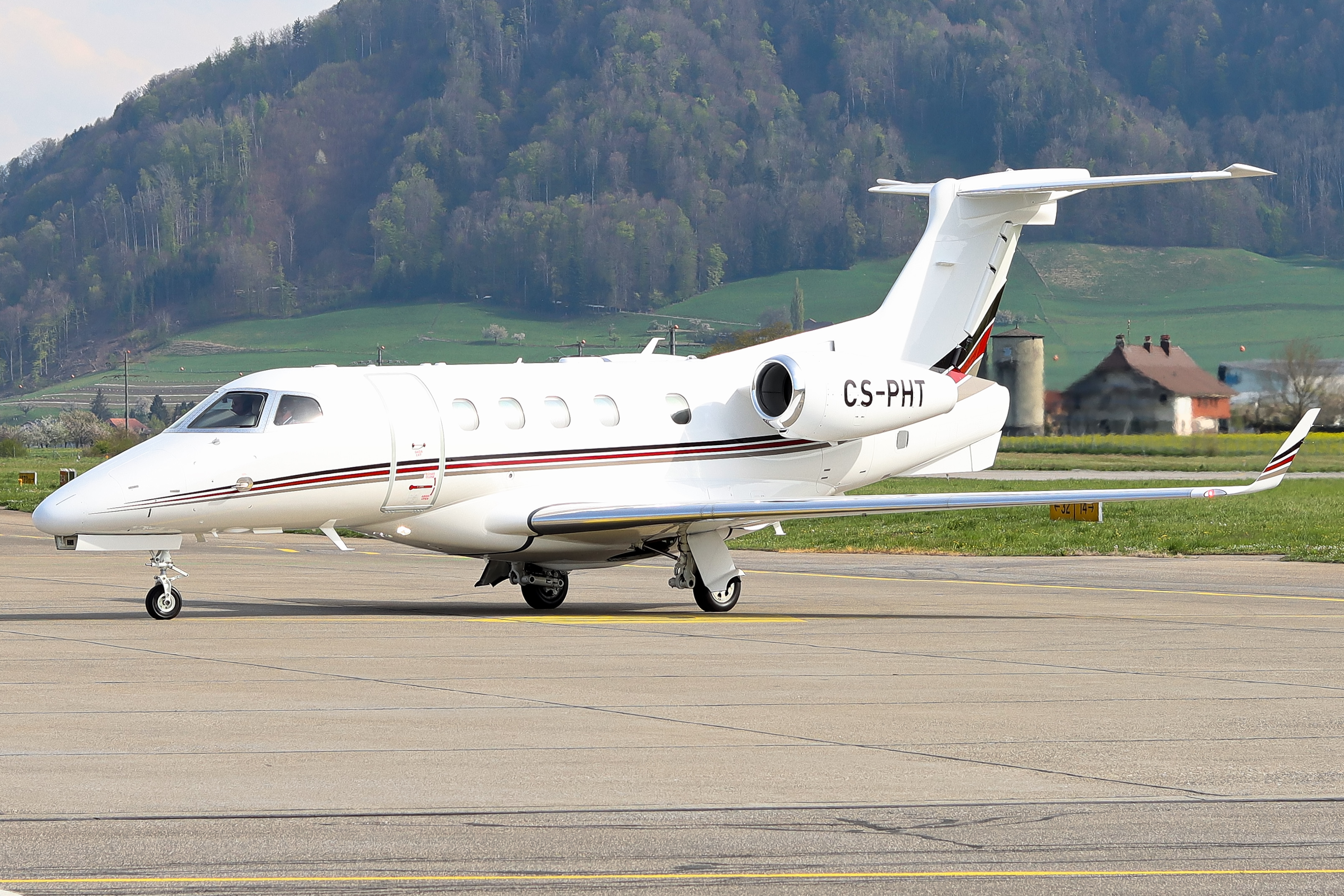 Full size: NetJets Embraer Phenom 300 CS-PHT at Bern Airport