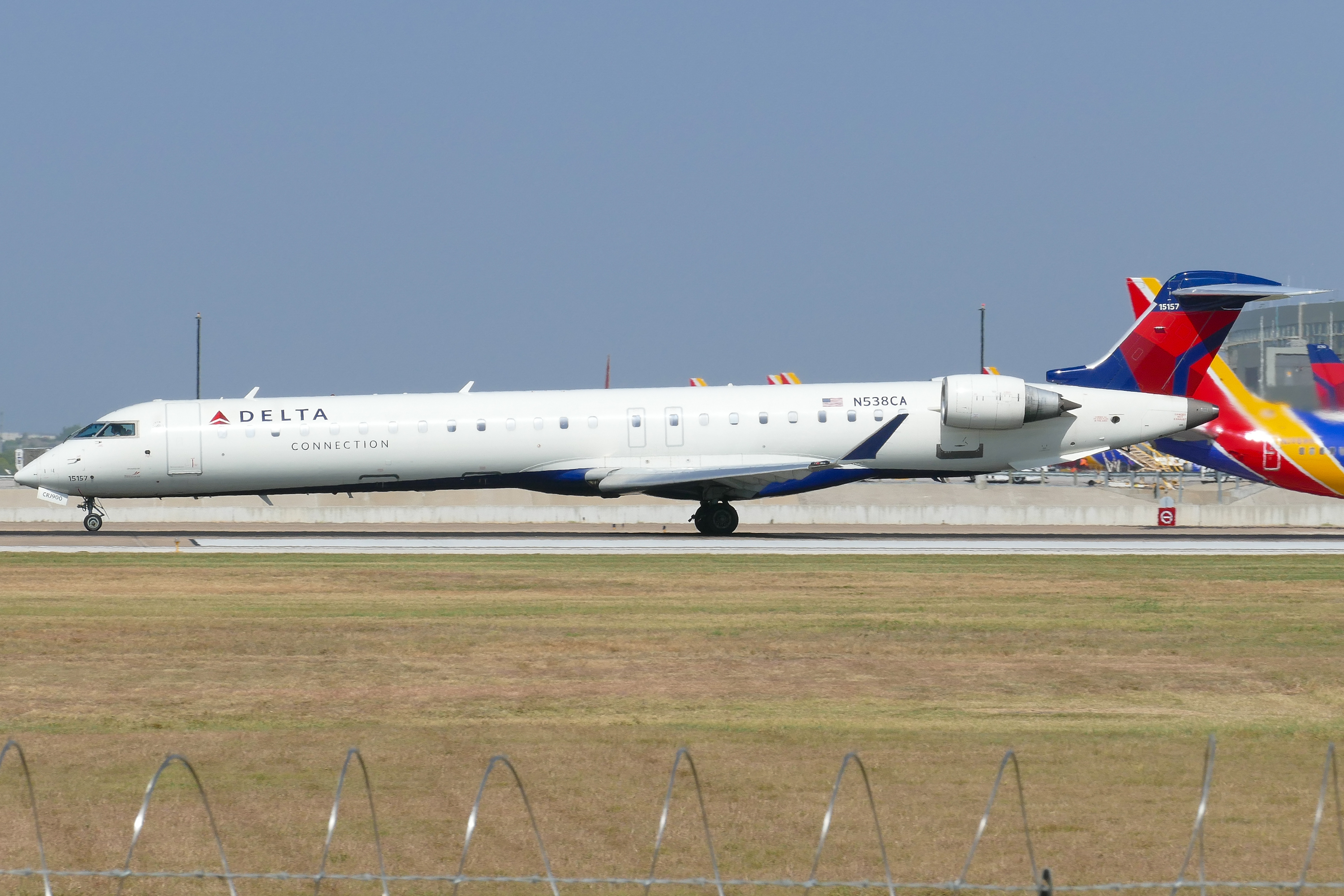 Full size: Delta Connection Mitsubishi CRJ-900 N538CA at Austin-Bergstrom International Airport