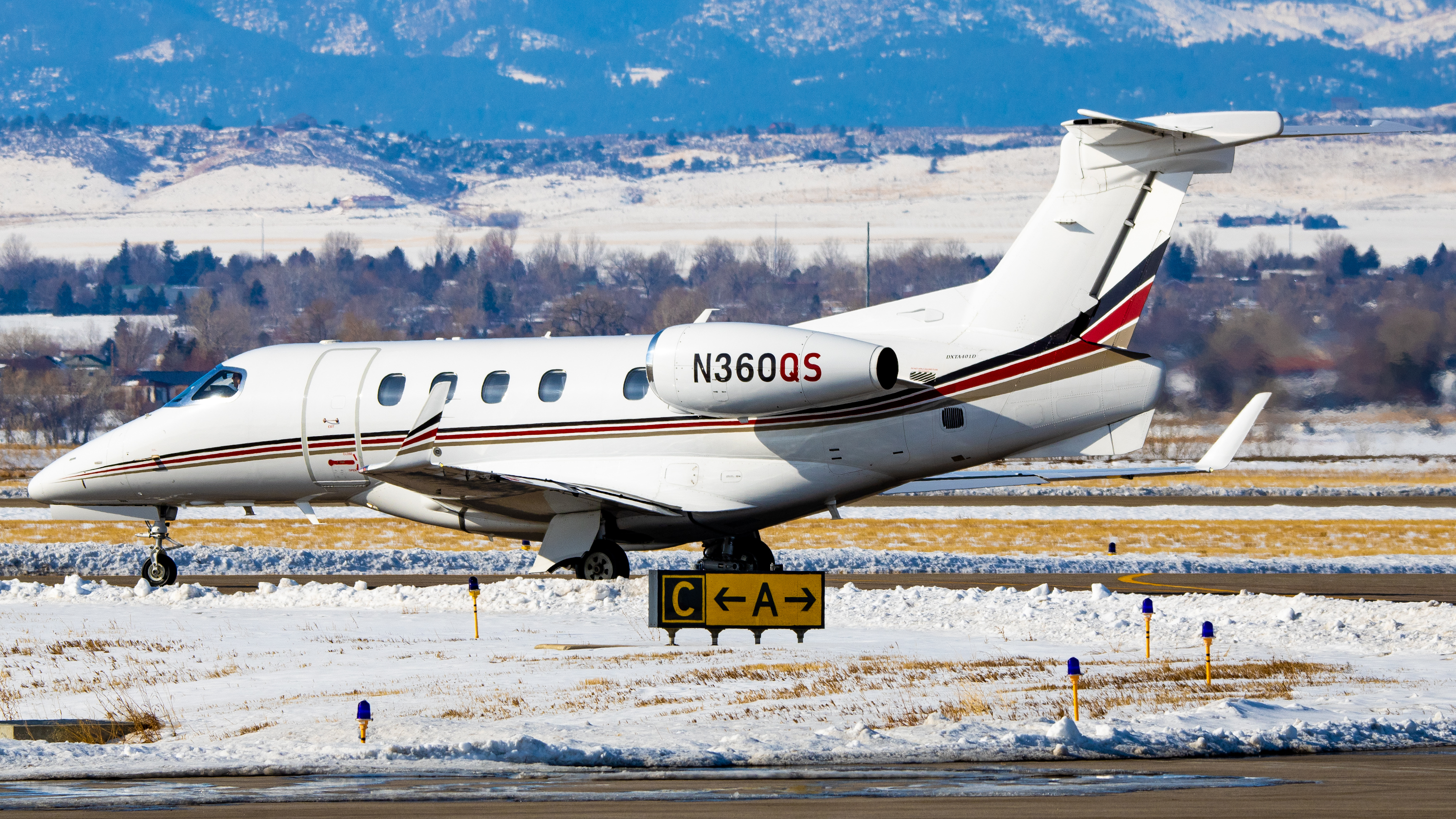 Full size: NetJets Embraer Phenom 300 N360QS at Northern Colorado Regional Airport