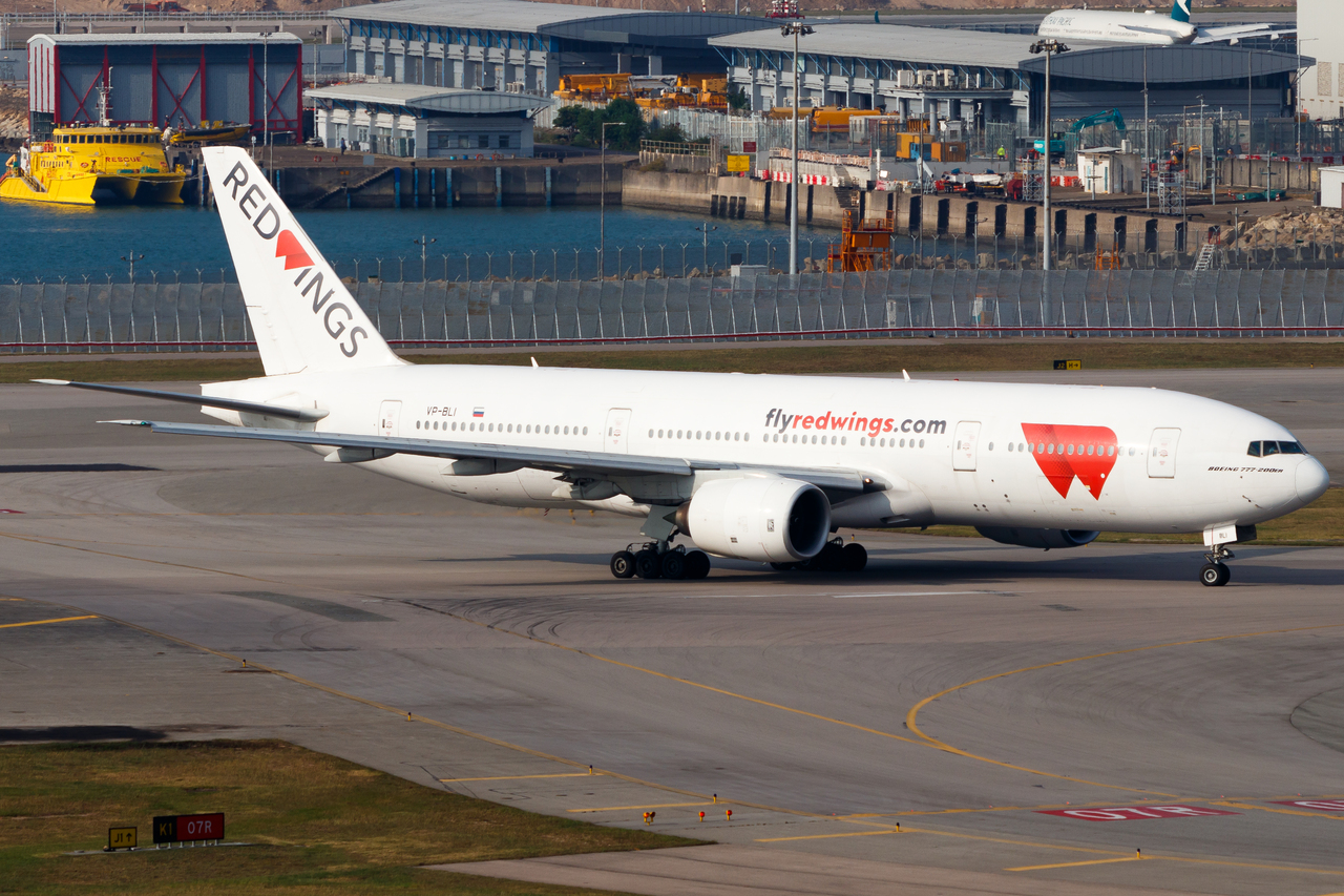Full size: Red Wings Boeing 777-200ER VP-BLI at Hong Kong International Airport