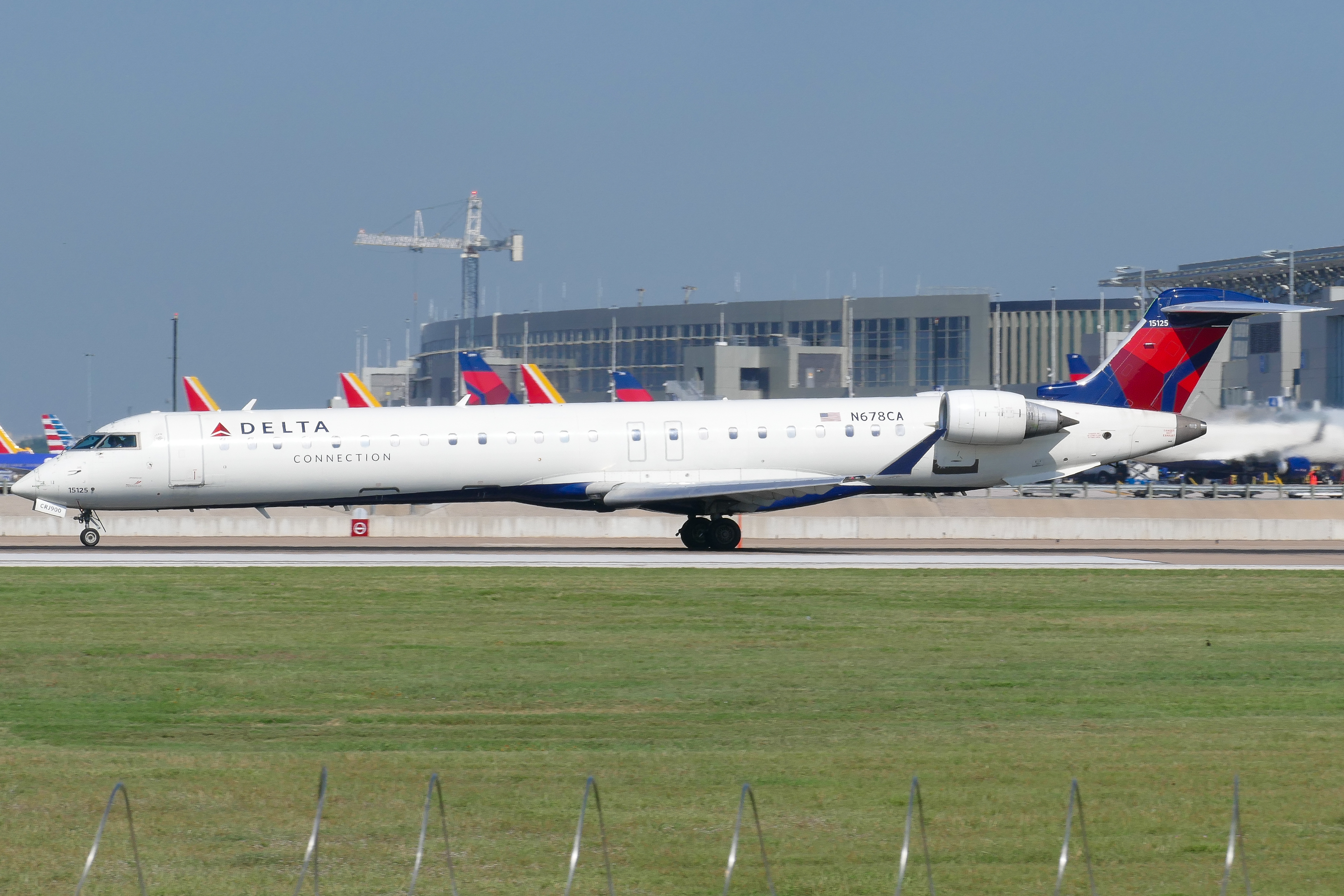 Full size: Delta Connection Mitsubishi CRJ-900 N678CA at Austin-Bergstrom International Airport