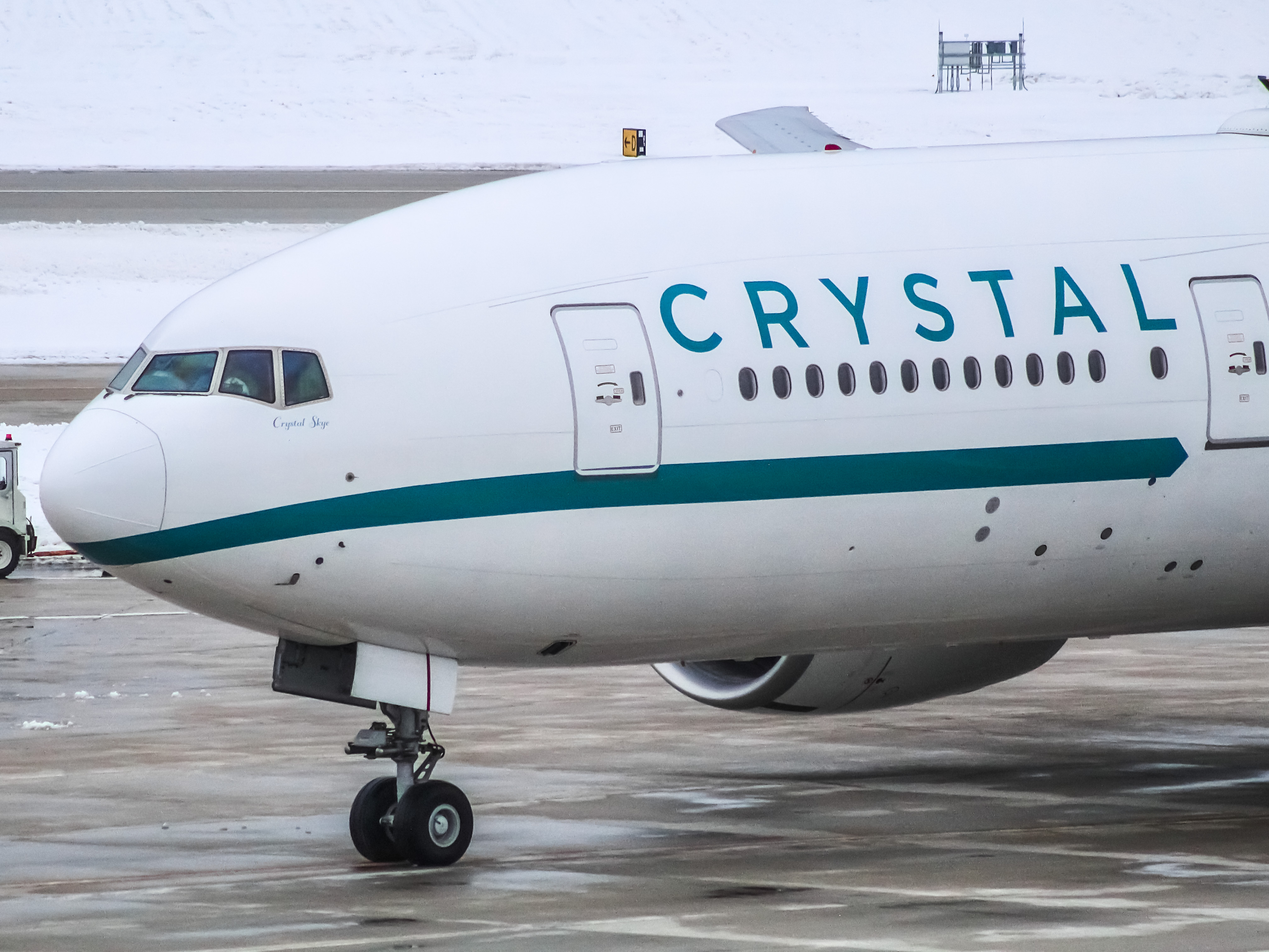 Full size: Crystal AirCruises Boeing 777-200LR P4-XTL at General Mitchell International Airport