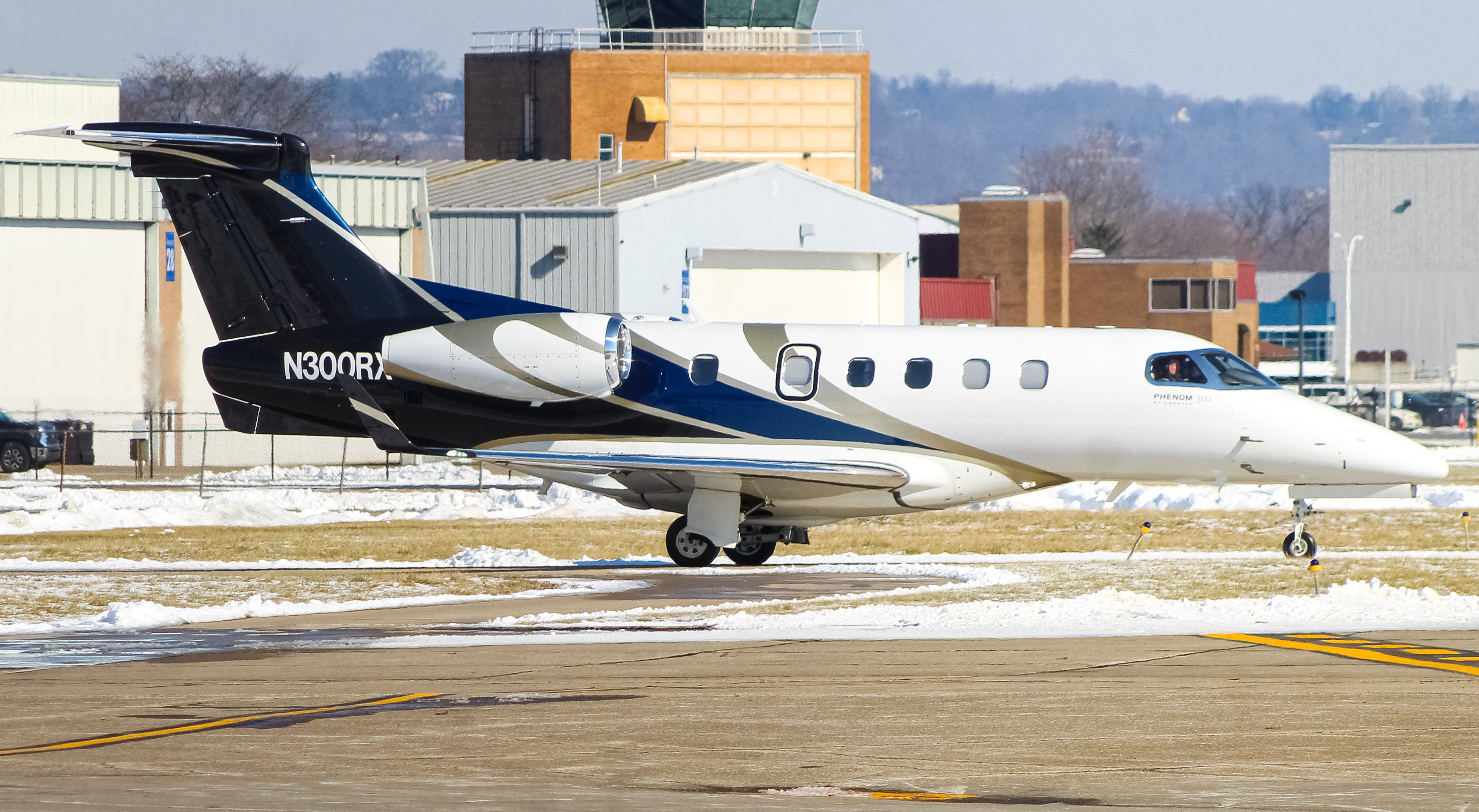 Full size: PRIVATE  Embraer Phenom 300 N300RX at Cincinnati Municipal Airport/Lunken Field