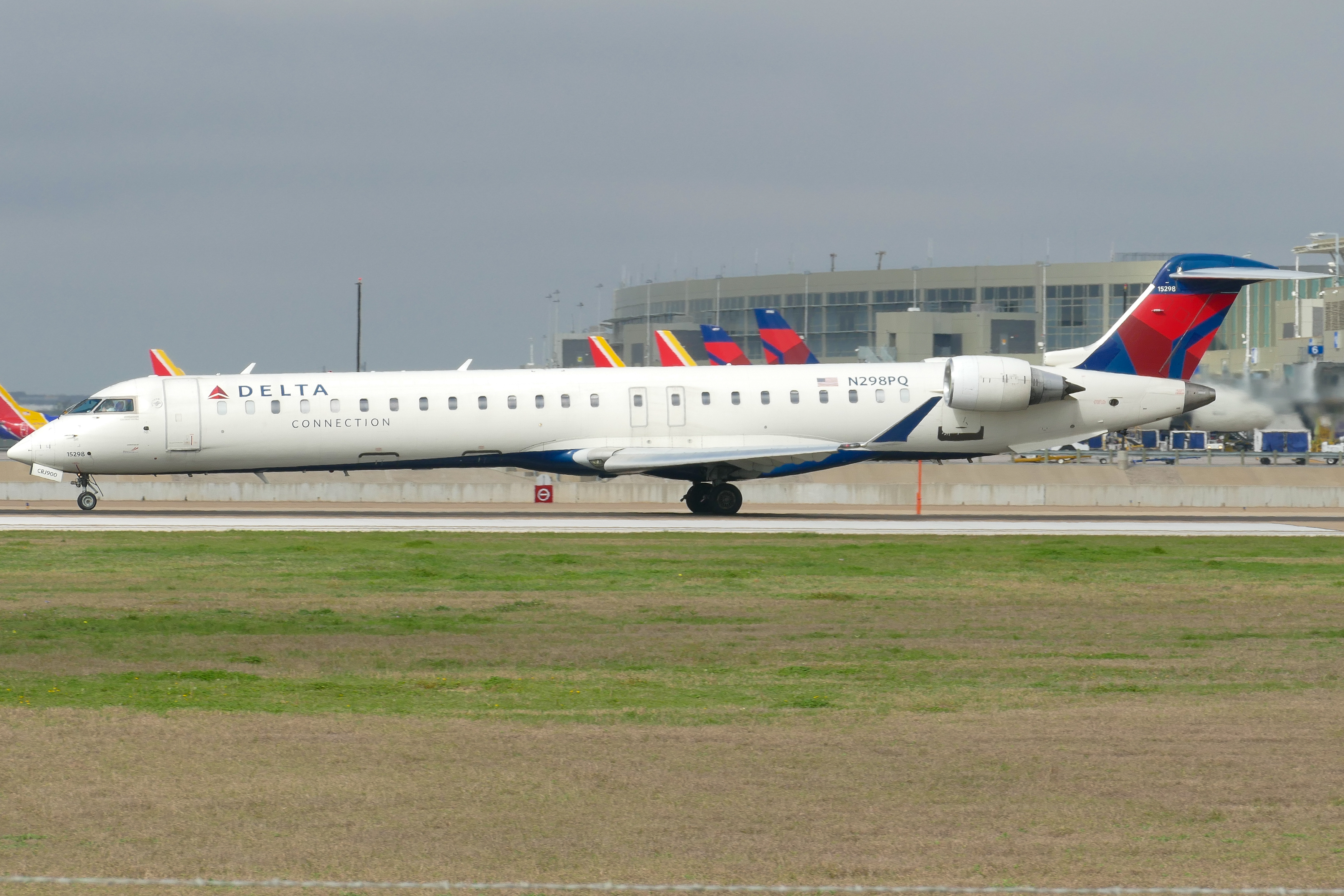 Full size: Delta Connection Mitsubishi CRJ-900 N298PQ at Austin-Bergstrom International Airport