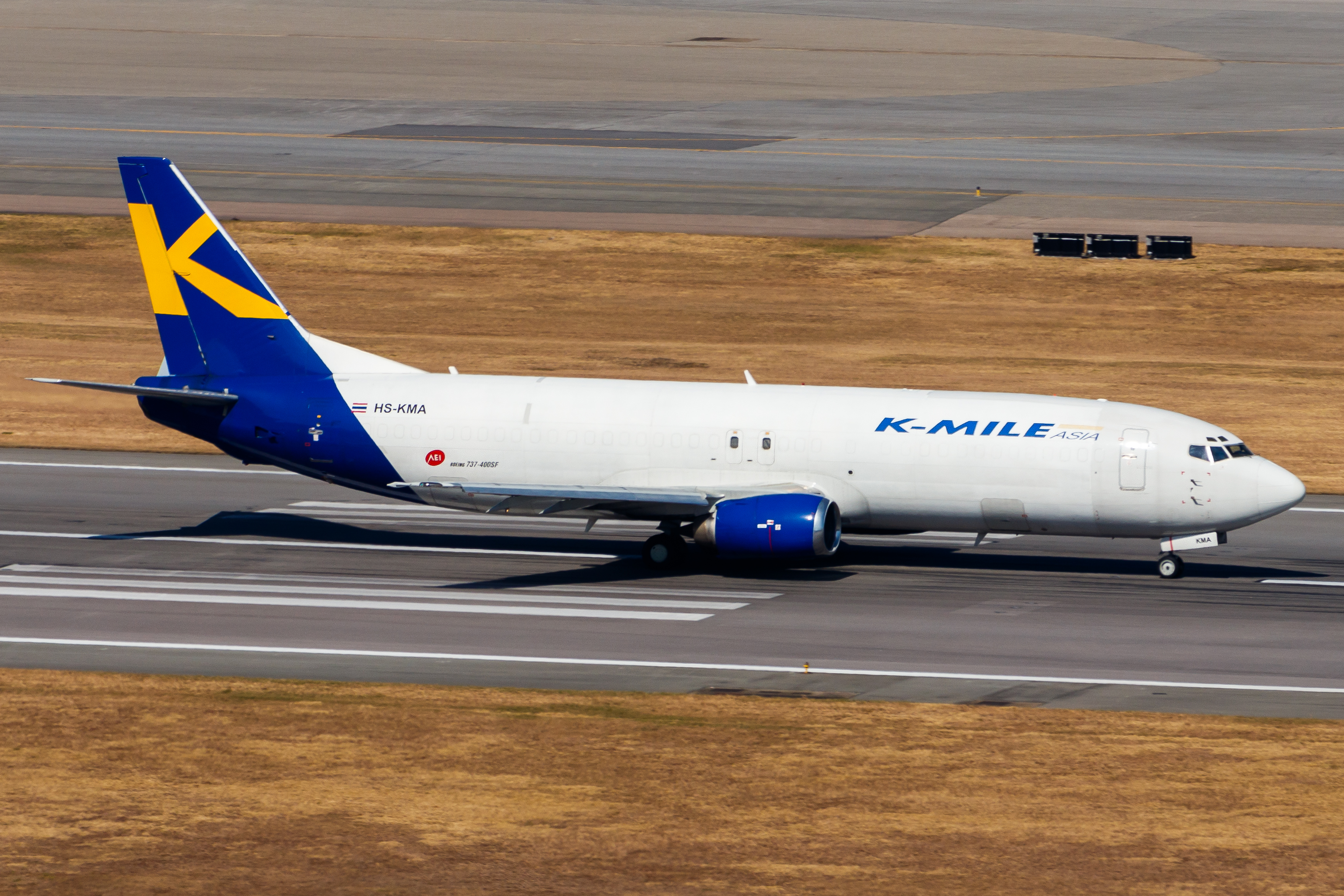 Full size: K-Mile Air Boeing 737-400F HS-KMA at Hong Kong International Airport