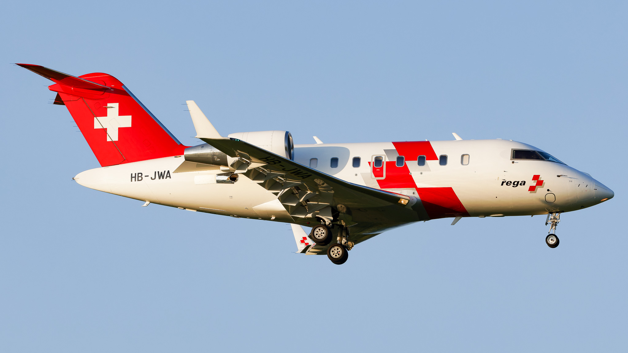 Full size:  REGA - Swiss Air Ambulance Bombardier CL-600-2B16  HB-JWA at Zurich-Kloten Airport