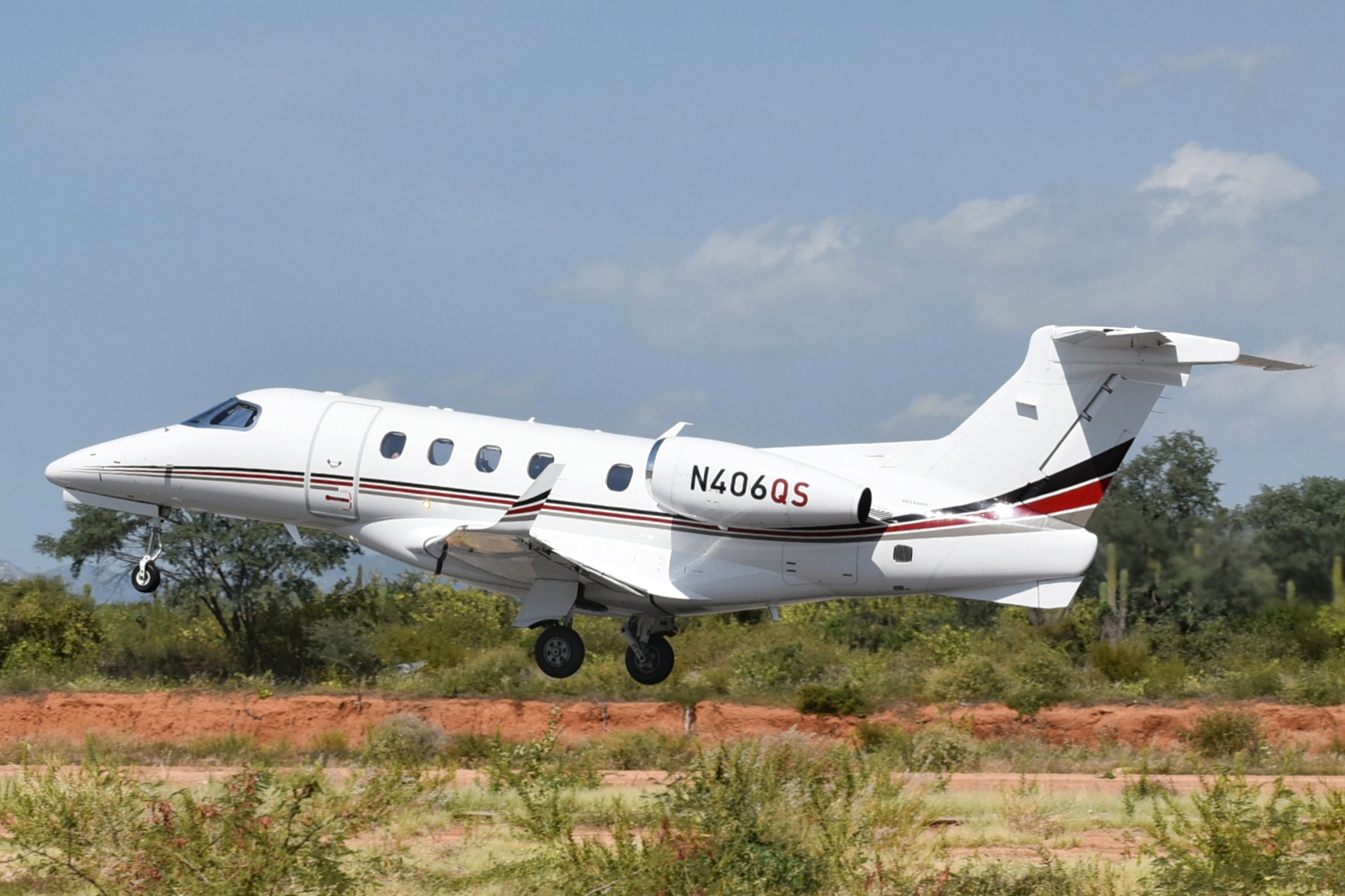 Full size: NetJets Embraer Phenom 300 N406QS at Aeropuerto de Cabo San Lucas Internacional