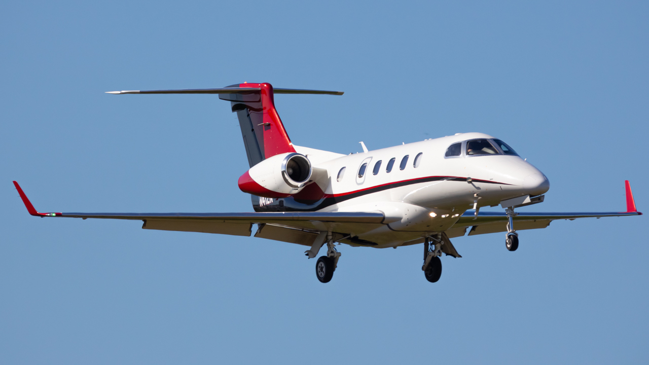 Full size: PRIVATE Embraer Phenom 300 N412N at Naples Municipal Airport