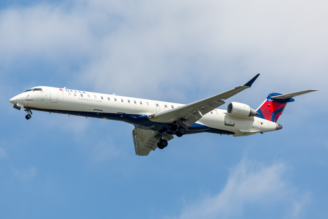 Full size: Delta Connection Mitsubishi CRJ-900 N133EV at John F. Kennedy International Airport