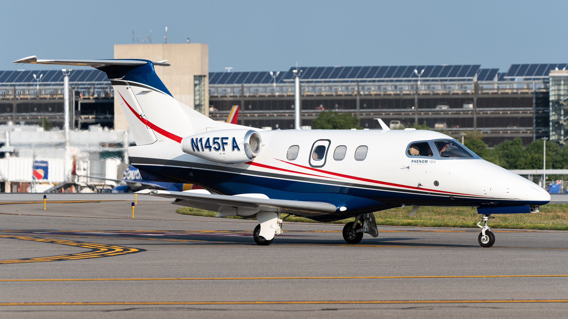 Full size: PRIVATE Embraer Phenom 100 N145FA at Manchester Airport