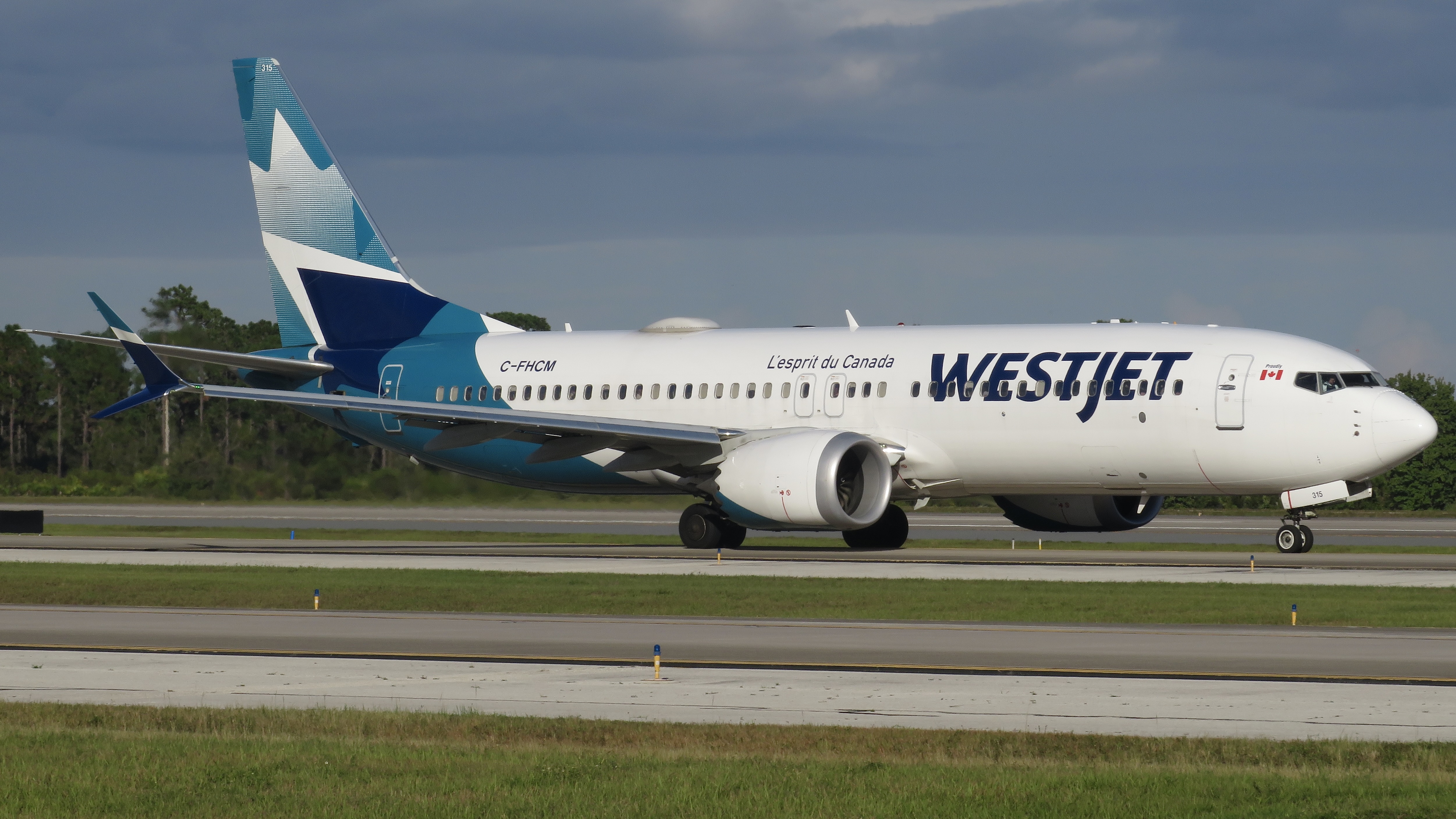 Full size: WestJet Boeing 737 MAX 8 C-FHCM at Orlando International Airport