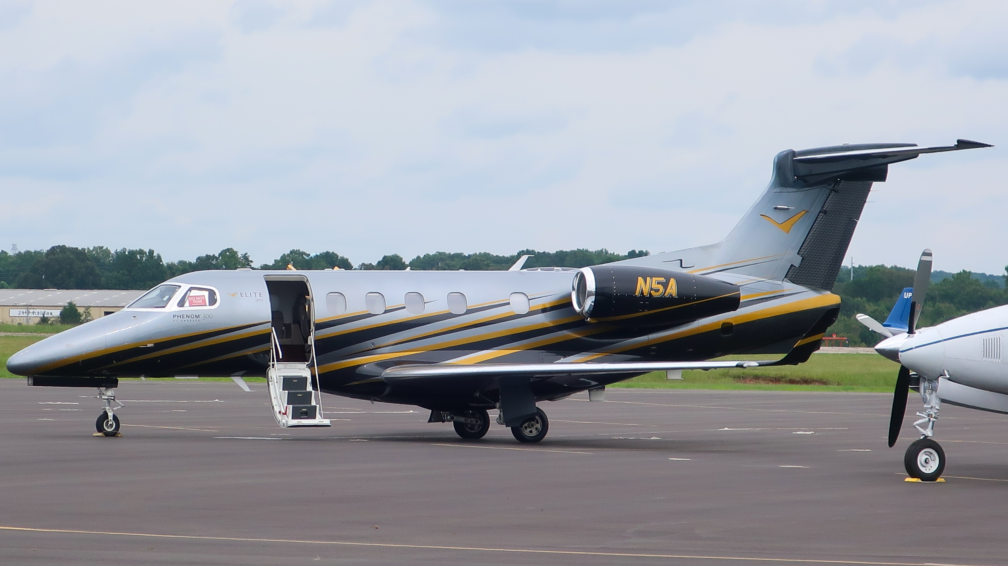 Full size: PRIVATE Embraer Phenom 300 N5A at Danville Regional Airport
