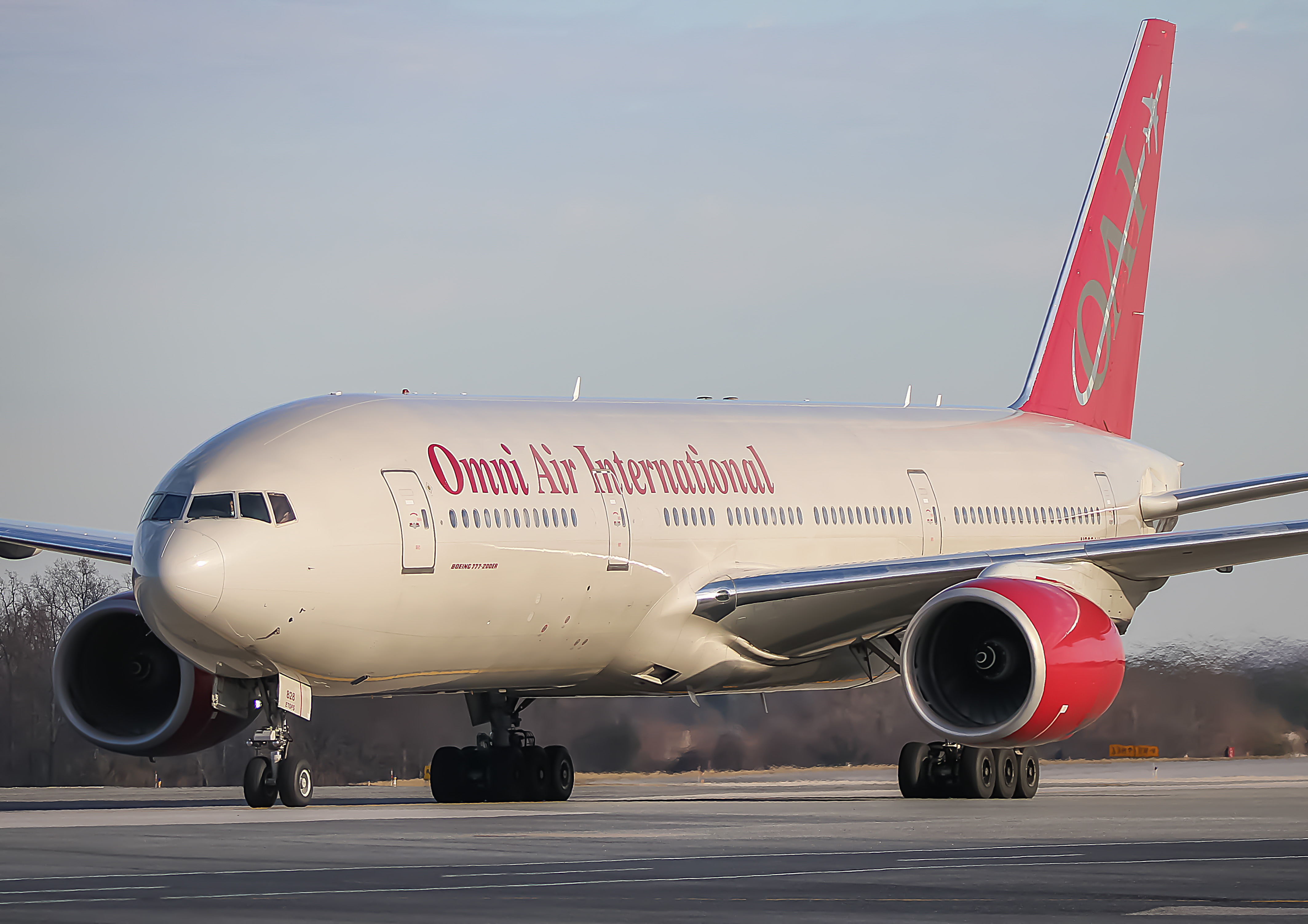 Full size: Omni Air International Boeing 777-200ER N828AX at Baltimore/Washington International Thurgood Marshall Airport
