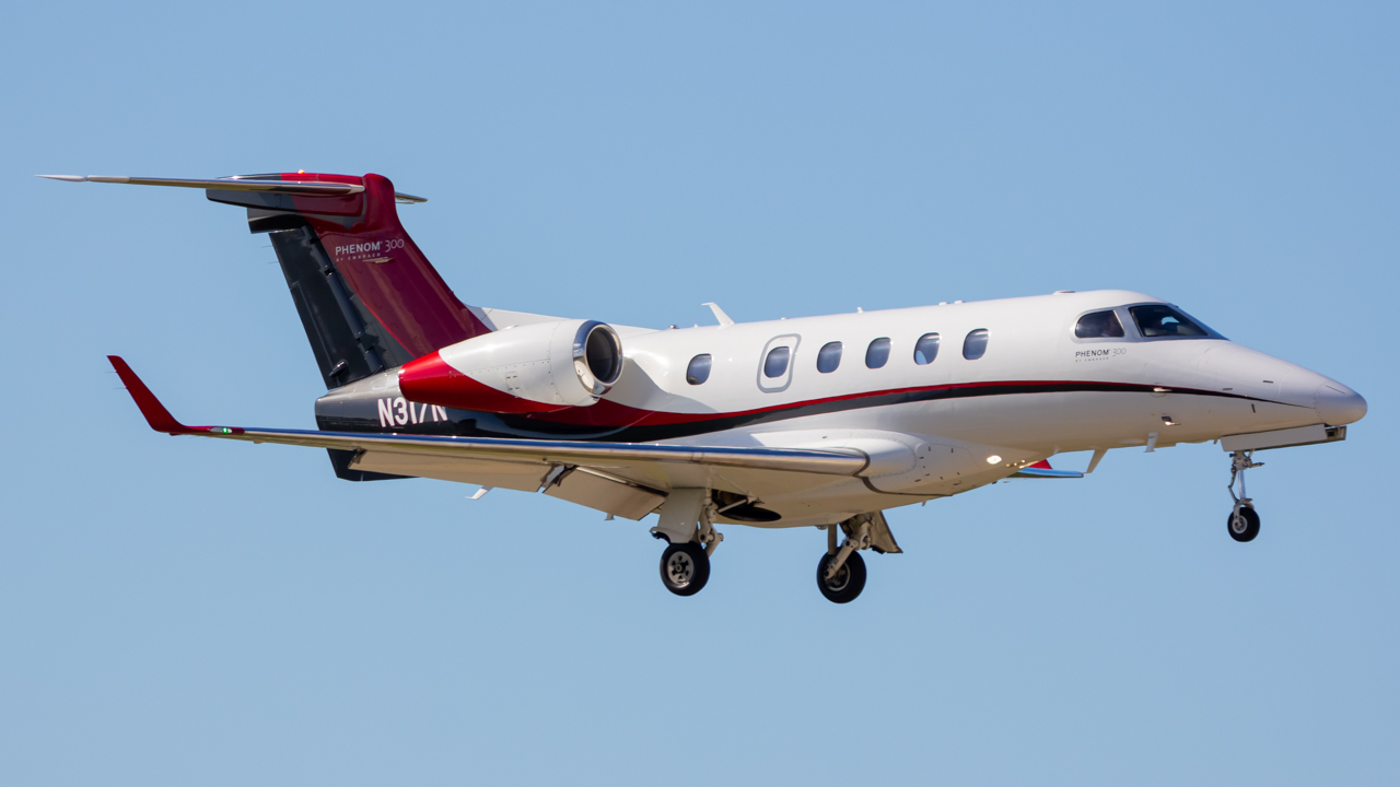 Full size: PRIVATE Embraer Phenom 300 N317N at Naples Municipal Airport