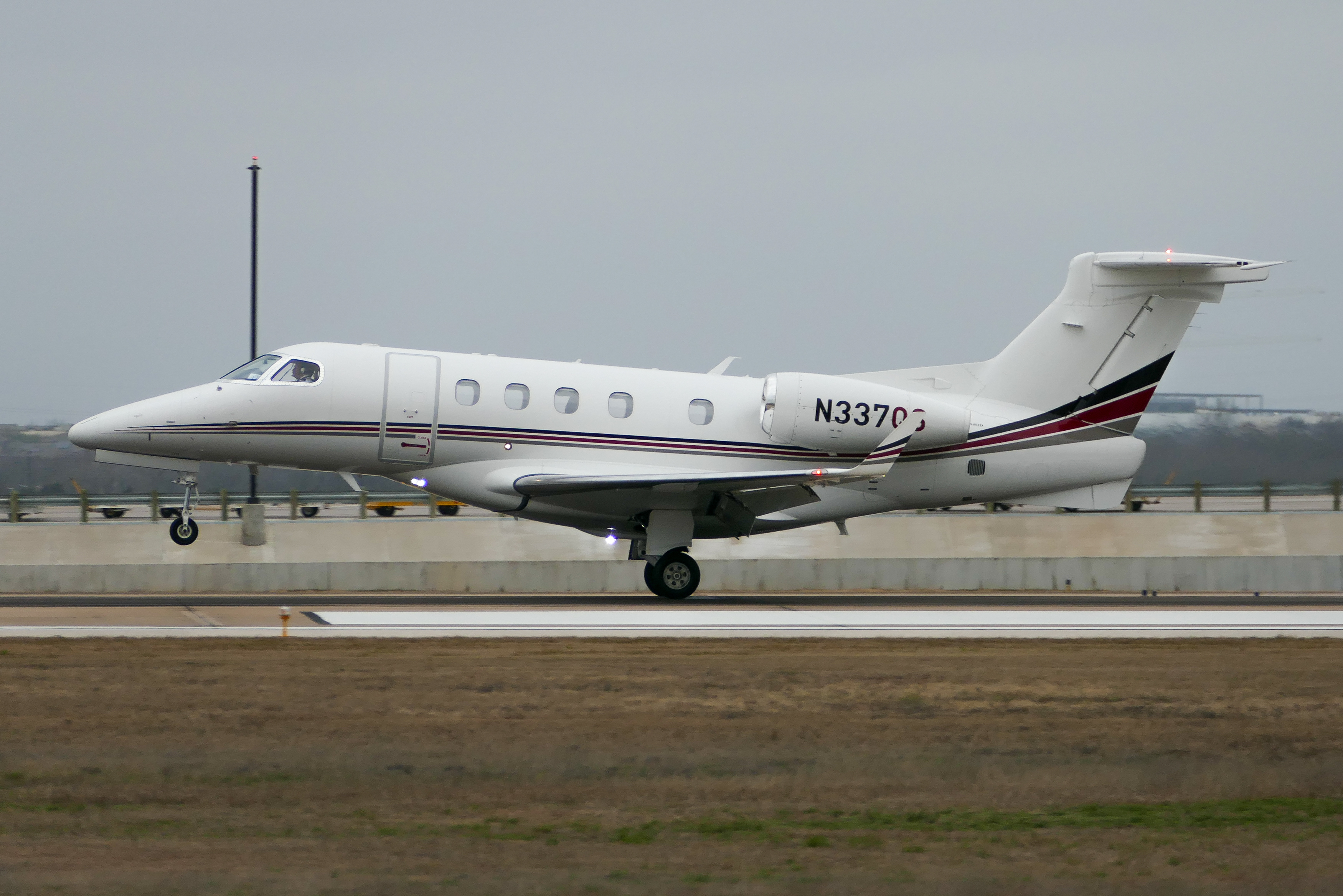 Full size: NetJets Embraer Phenom 300 N337QS at Austin-Bergstrom International Airport